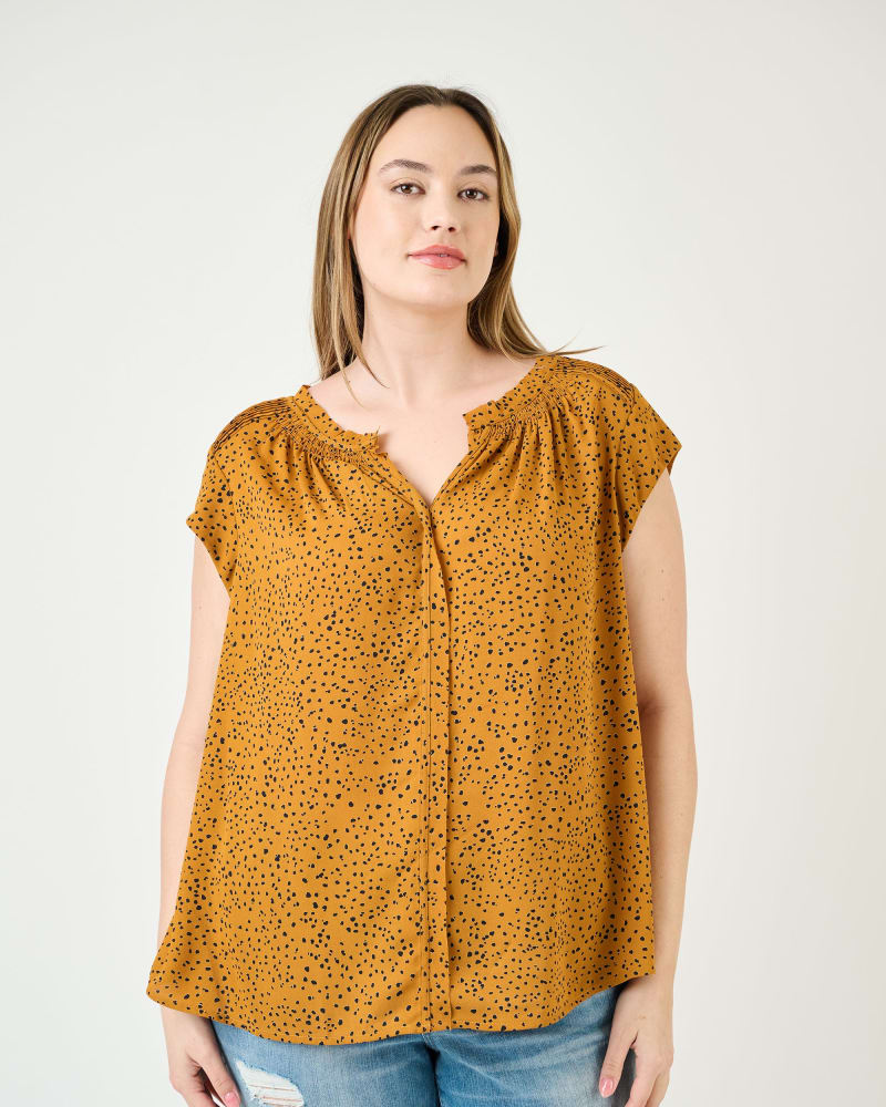 Front of a model wearing a size 2X Hazel Smocked Top with Split V-Neck in M974 GOLD by Daniel Rainn. | dia_product_style_image_id:304874